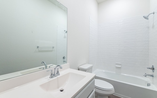 full bathroom featuring vanity, toilet, and tiled shower / bath combo