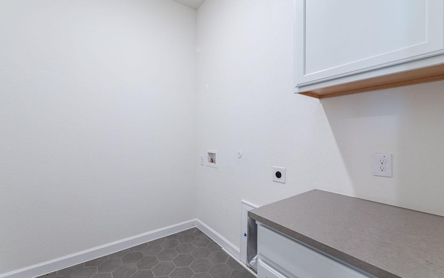 laundry area with hookup for a washing machine, hookup for a gas dryer, hookup for an electric dryer, baseboards, and cabinet space