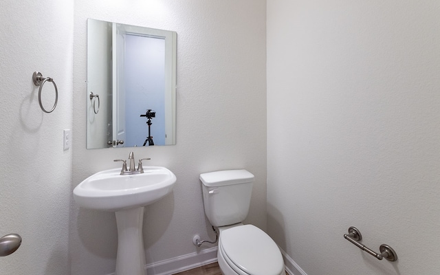 bathroom featuring toilet