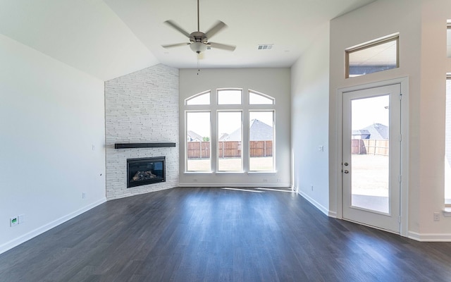 unfurnished living room featuring high vaulted ceiling, a stone fireplace, ceiling fan, and dark hardwood / wood-style floors