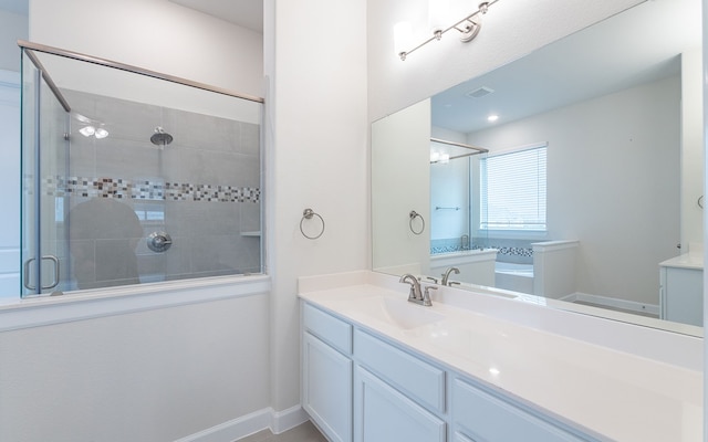 bathroom featuring an enclosed shower and vanity