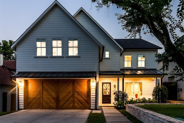 modern farmhouse style home featuring a garage