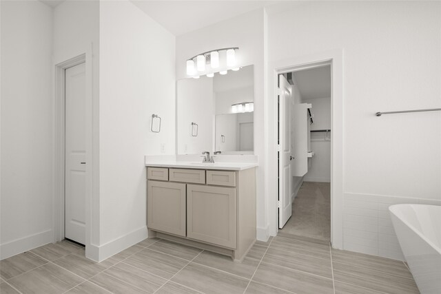 bathroom featuring a tub and vanity