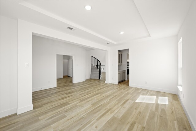 spare room featuring light wood-type flooring