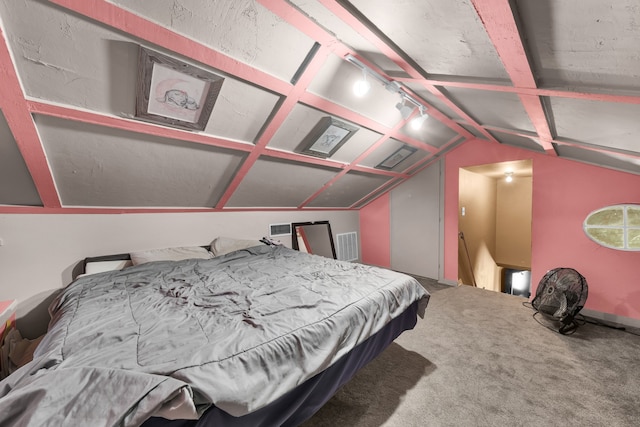 bedroom with vaulted ceiling and carpet