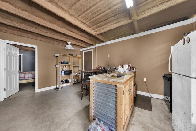 misc room with sink and concrete floors