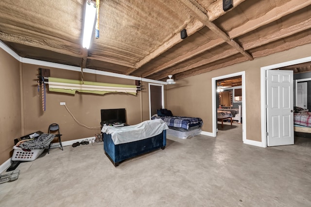 bedroom featuring concrete flooring