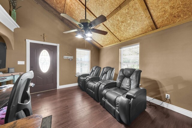 home theater featuring a wealth of natural light, dark wood-type flooring, high vaulted ceiling, and ceiling fan