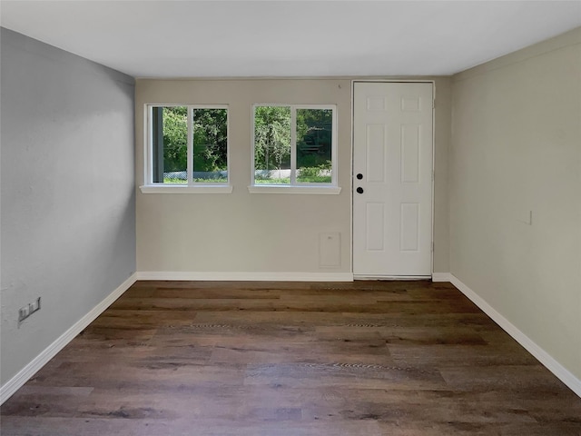 unfurnished room featuring dark hardwood / wood-style floors