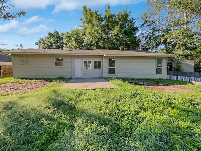 rear view of house featuring a patio