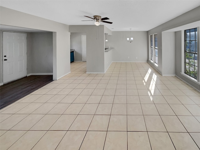 interior space featuring ceiling fan and light tile floors