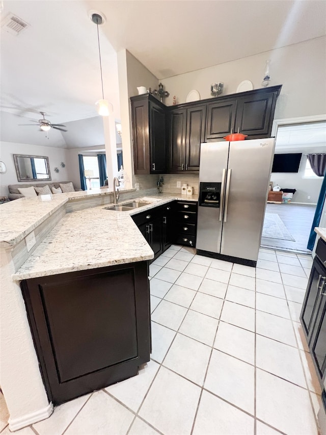 kitchen featuring stainless steel refrigerator with ice dispenser, decorative light fixtures, kitchen peninsula, ceiling fan, and sink