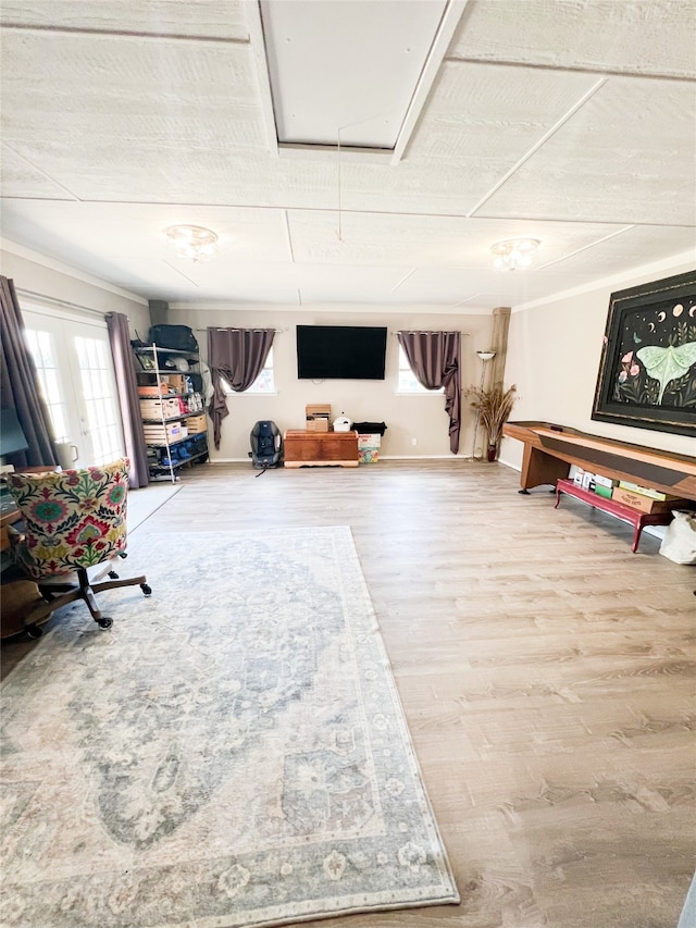 interior space featuring ornamental molding and hardwood / wood-style flooring