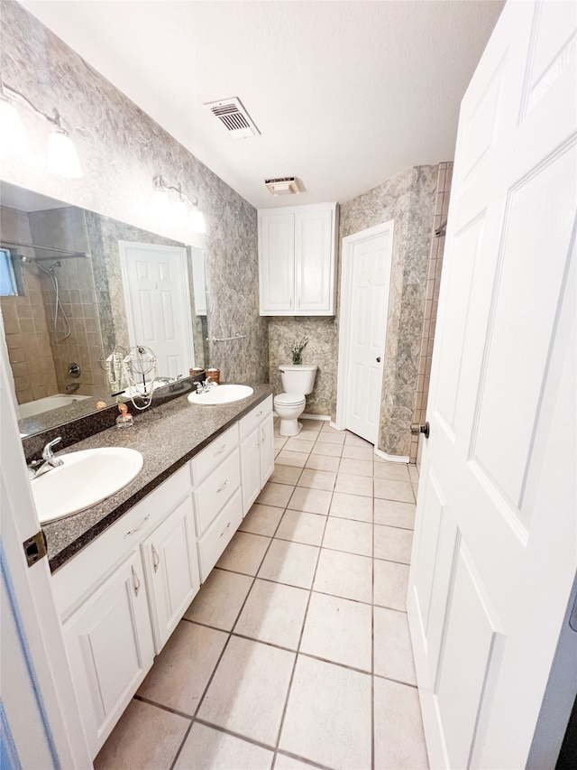 full bathroom with a bidet, dual sinks, toilet, tile flooring, and large vanity