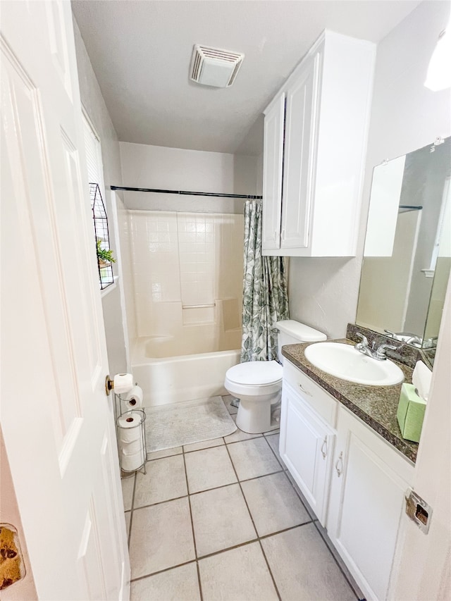 full bathroom with shower / bathtub combination with curtain, tile flooring, toilet, and vanity with extensive cabinet space