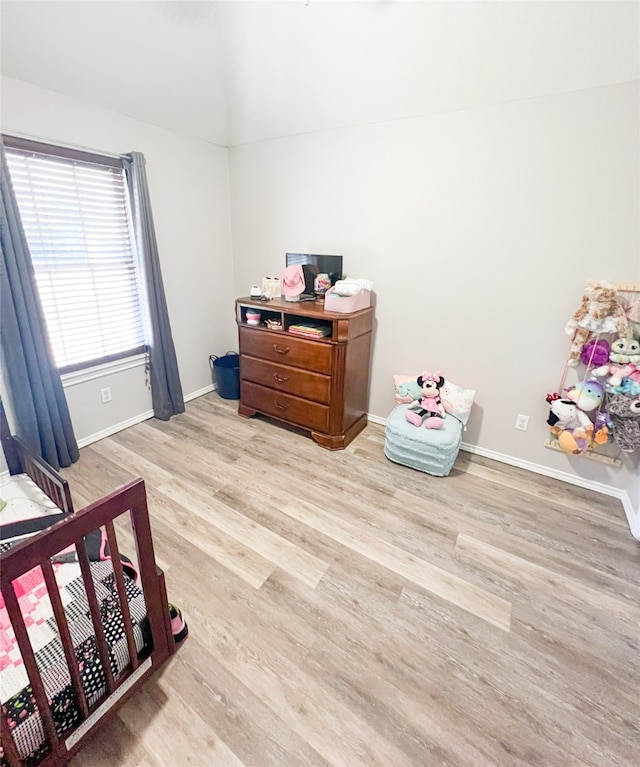 bedroom with hardwood / wood-style flooring