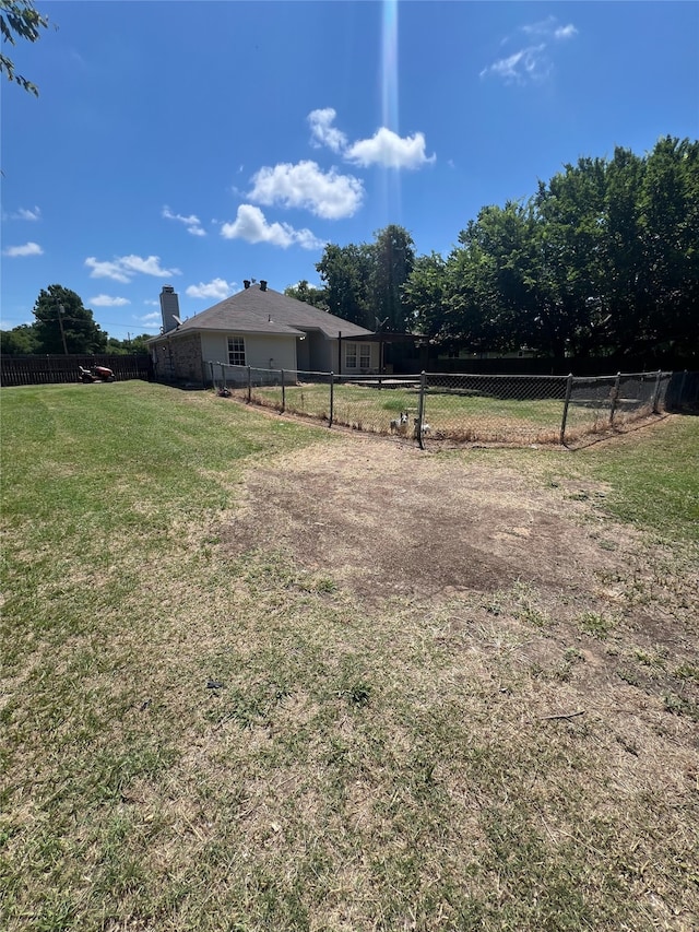 view of yard with a rural view