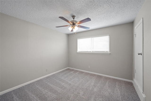 carpeted empty room with ceiling fan and a textured ceiling