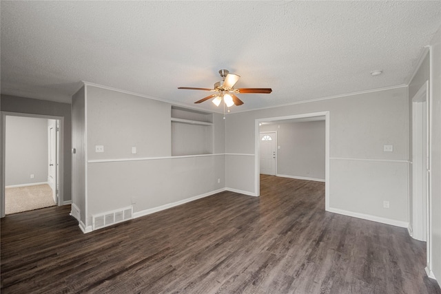 unfurnished room with ceiling fan, dark hardwood / wood-style flooring, a textured ceiling, and ornamental molding