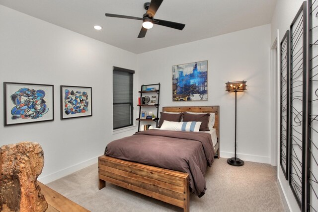 bedroom with light carpet, ceiling fan, recessed lighting, and baseboards