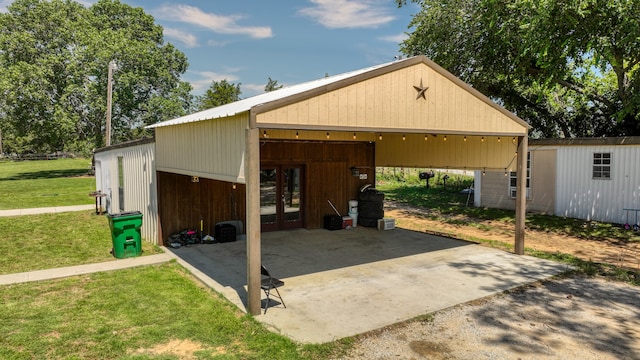 garage featuring a lawn