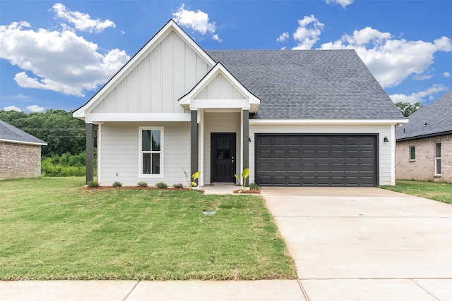 view of front facade featuring a front yard and a garage