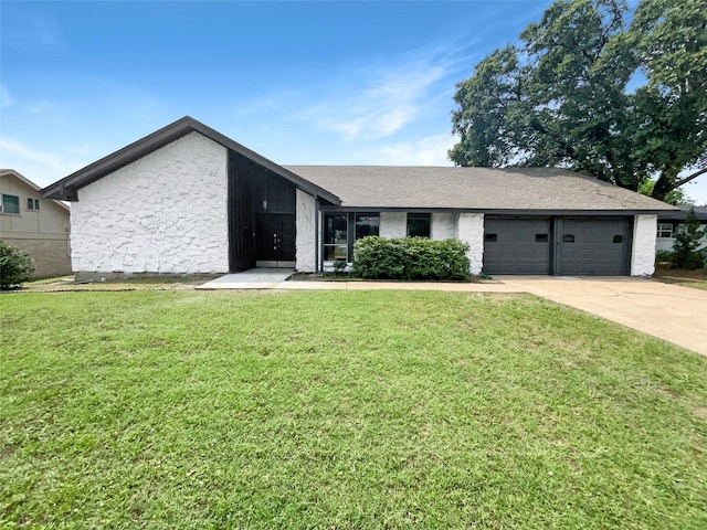 ranch-style home with a garage and a front yard