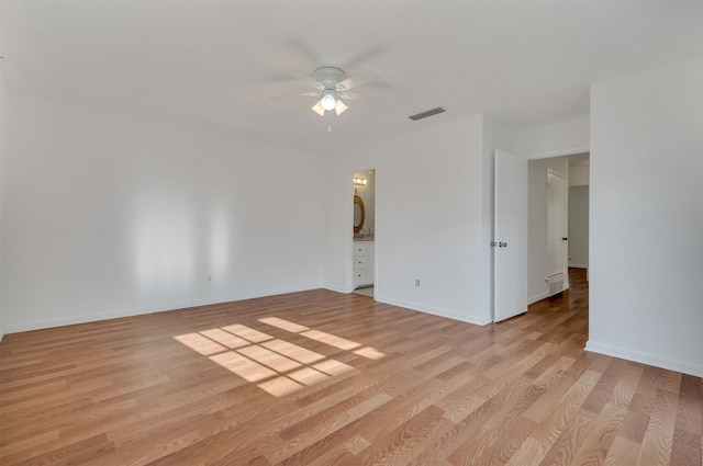 unfurnished room with light wood-type flooring and ceiling fan