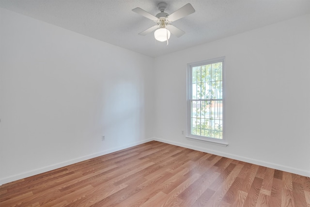 empty room featuring light hardwood / wood-style floors and ceiling fan