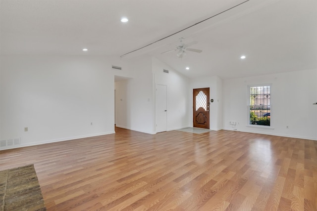 unfurnished living room with high vaulted ceiling, ceiling fan, and light wood-type flooring