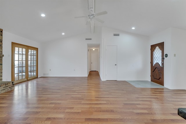 unfurnished living room featuring high vaulted ceiling, ceiling fan, and light hardwood / wood-style flooring