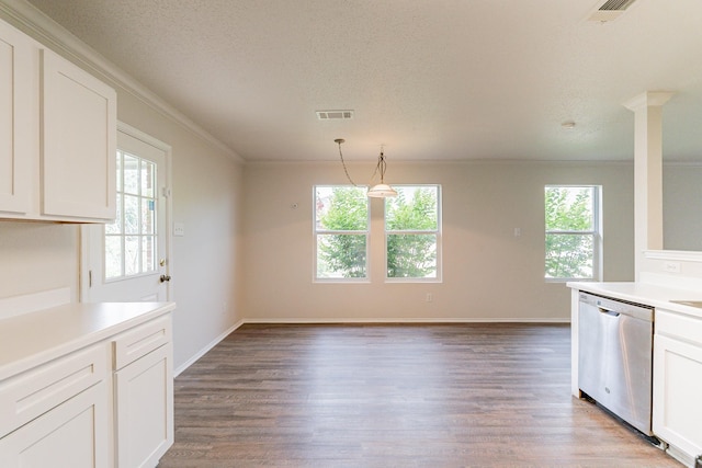 kitchen featuring a wealth of natural light, white cabinetry, dishwasher, and pendant lighting