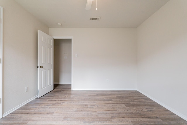 empty room with light hardwood / wood-style floors and ceiling fan