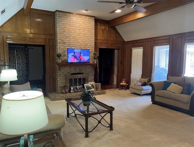 living room with lofted ceiling with beams, light colored carpet, wood walls, and a fireplace