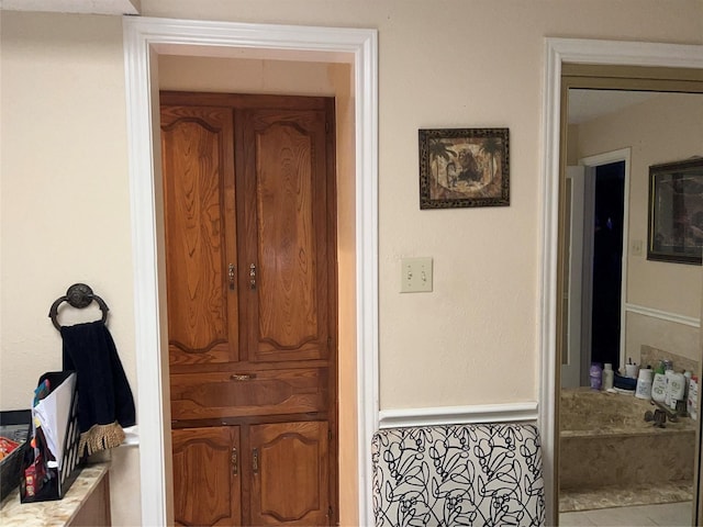 bathroom with tile patterned floors