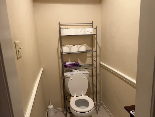 bathroom with tile flooring and toilet