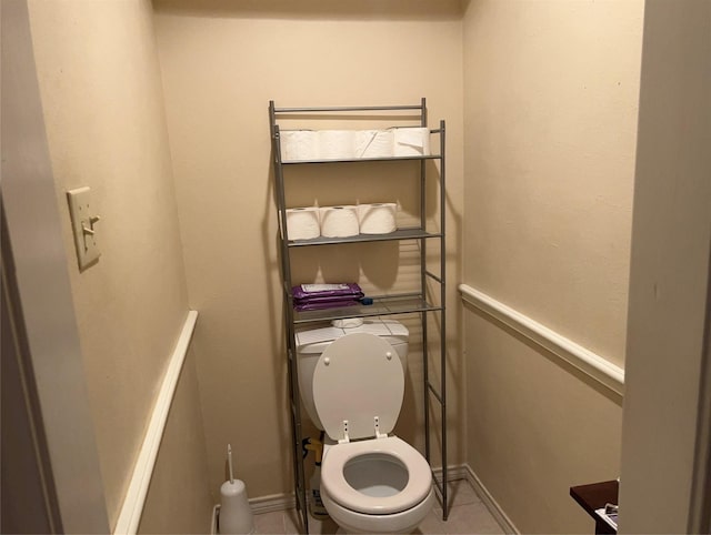 bathroom with tile patterned flooring and toilet