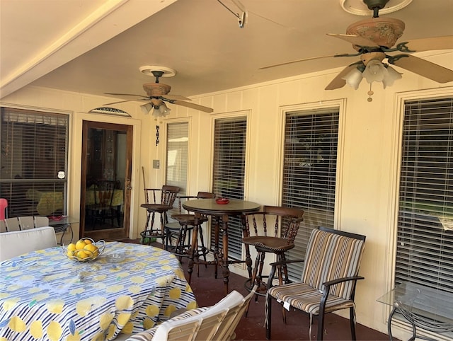 exterior space featuring outdoor dining area and ceiling fan