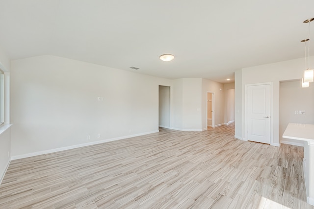 spare room featuring light hardwood / wood-style floors