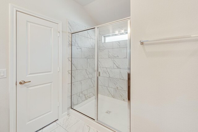 bathroom with tile patterned flooring and a shower with shower door