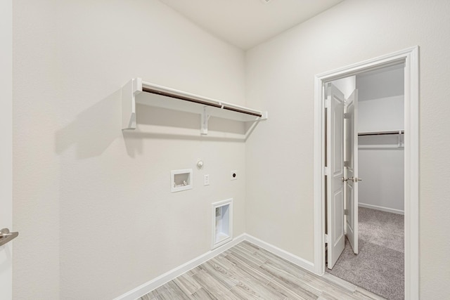 laundry area featuring hookup for a gas dryer, laundry area, washer hookup, baseboards, and electric dryer hookup