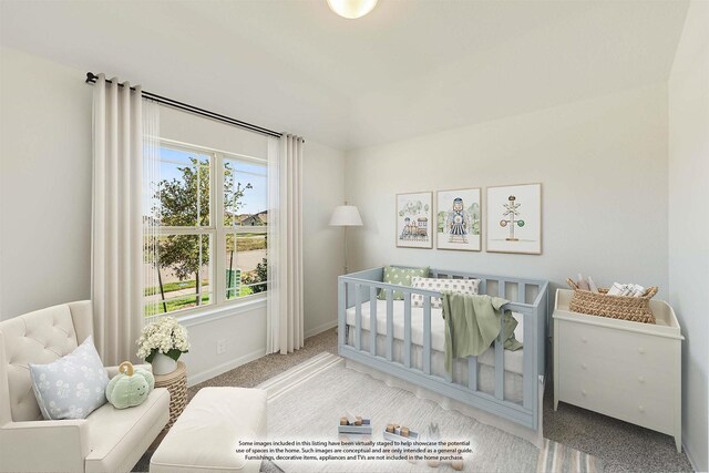 carpeted bedroom featuring a crib