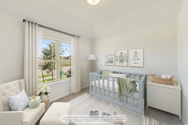 bedroom with carpet flooring, a crib, and baseboards