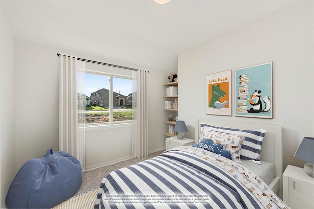 bedroom featuring carpet flooring and baseboards