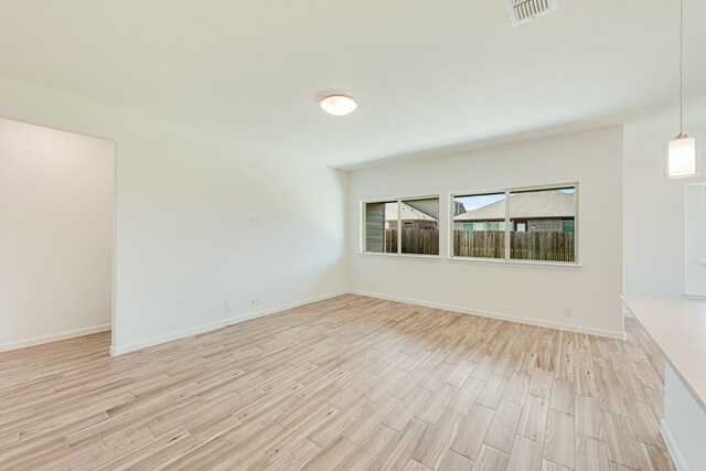 unfurnished living room with light wood-type flooring