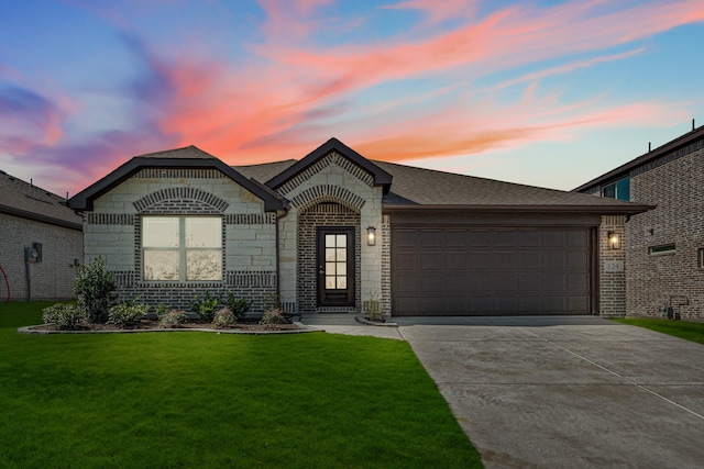 view of front of house with driveway, an attached garage, a front yard, and brick siding