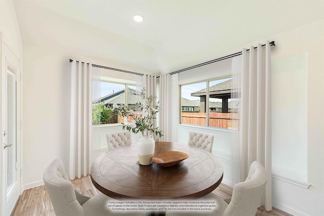 dining room featuring baseboards, recessed lighting, plenty of natural light, and light wood-style floors