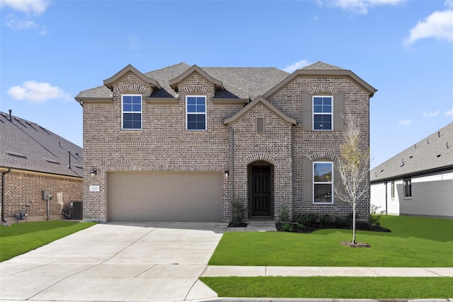 view of front of house featuring a garage, central AC, and a front yard