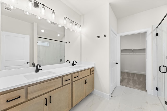 bathroom with vanity and an enclosed shower