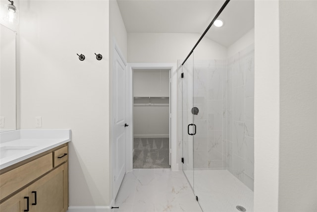 bathroom featuring vanity and an enclosed shower